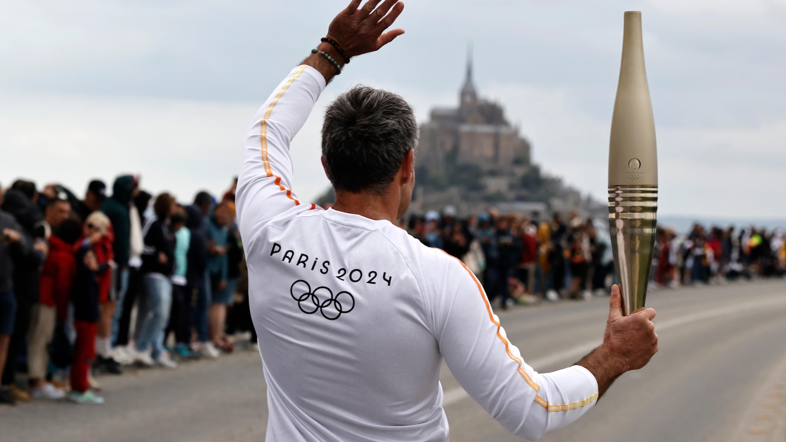 France's Bastille Day parade meets the Olympic torch relay in an