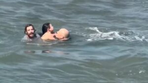 WATCH:  Surfing coach rescues dad, daughter from rip current
