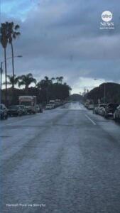WATCH:  California woman finds herself on edge of advancing rain shower