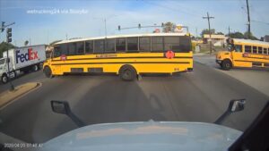 WATCH:  New Orleans truck driver narrowly avoids school bus that pulled into oncoming traffic