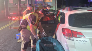 Car collides with semi-truck in suspected DUI crash