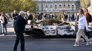 Paris police report 855 arrests after violent clashes and looting during protests